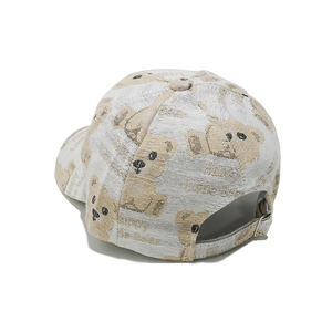 Detail of adjustable metal buckle and cute bear print on white fashion baseball cap