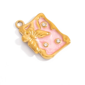 Macro shot of 18K gold plated butterfly charm with pink enamel and sparkling rhinestones