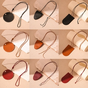 Vintage leather heart and geometric pendant necklaces in black, caramel, and burgundy