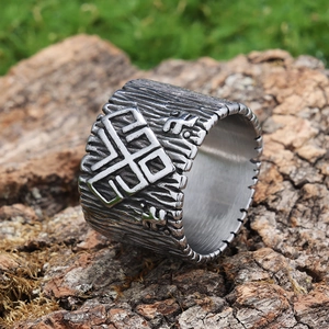 Macro shot of retro silver stainless steel wide ring with geometric ethnic engraving