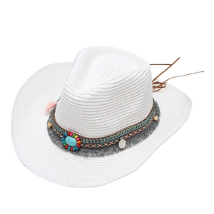 Detail of bohemian white straw cowboy hat with turquoise beads and tassel trim
