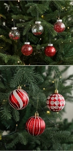 Close-up of red and white 6cm Christmas balls with glitter and patterns on a tree