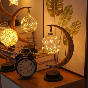 Close-up of three rustic decorative table lamps with hemp rope and warm LED lighting