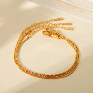 Three-piece layered gold stainless steel bracelet set with cable and bead chain designs