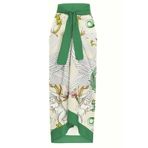Detail of classical swan print sarong with green waist tie and intricate motifs