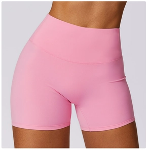 Detail showing the flatlock seams and smooth texture of high-waist pink yoga shorts