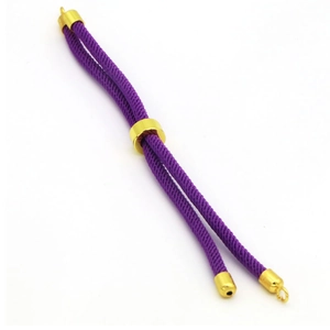 Detail of purple braided DIY bracelet cord with adjustable gold metal slider clasp