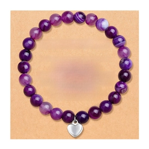 Purple agate beaded friendship bracelet with silver heart charm on greeting card