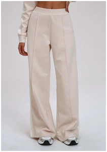 Detail of high-waisted wide-leg sweatpants with side stripes and front seam details