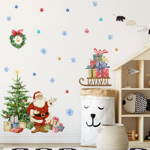 Watercolor Santa and Christmas tree wall stickers in a cozy nursery room setting