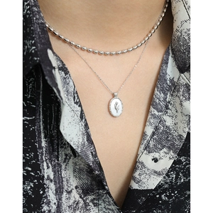 Minimalist S925 sterling silver layered necklace with oval tulip shell pendant on model