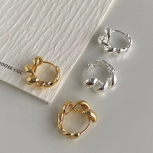 Elegant twisted rope hoop earrings set in gold and silver finish with metallic texture
