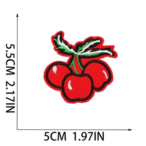 Detail view of red cherry embroidery patch with size measurements 5.5cm by 5cm on white base