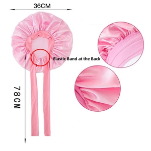 Pink satin hair bonnet detail with elastic band and 78cm long ribbons for sleep