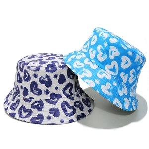 Canvas bucket hats with graffiti heart prints in white and blue for stylish sun protection