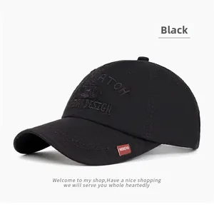 Detailed close-up of black cotton baseball cap with embroidery and side red fashion tag