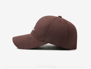 Side view of dark brown baseball cap featuring white LIFE embroidery on cotton fabric