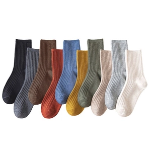 Vertical ribbed cotton crew socks in 10 diverse colors on a minimalist white background
