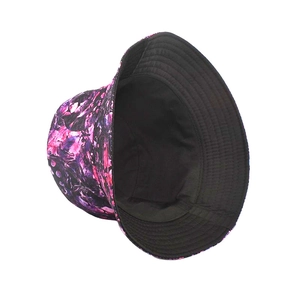 Detail of double-sided tie-dye bucket hat featuring purple abstract print and black lining