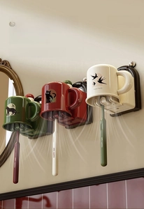 Detail of wall-mounted toothbrush holders with inverted cups for quick drainage and drying