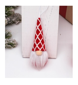 Close-up of knit Christmas gnome ornament with red diamond pattern and white faux fur beard