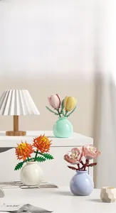 Detailed view of floral building blocks with tulip and peony in colorful mini vases