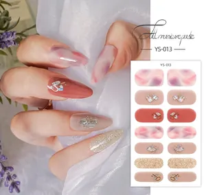 Detail of YS-013 nail wraps featuring purple marble designs with glitter and rhinestones