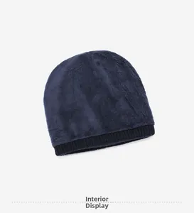 Detailed view of the thick dark blue faux fur lining inside the warm knitted beanie