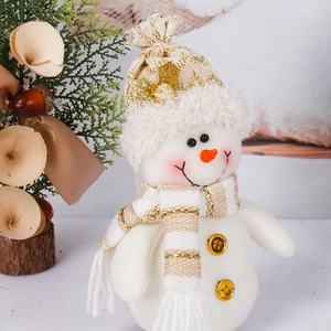 Charming white and gold plush Christmas snowman with knitted hat on a wooden base