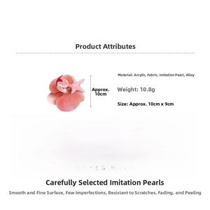 Detail view of pink fabric flower hair clip with acrylic starfish and imitation pearl accents