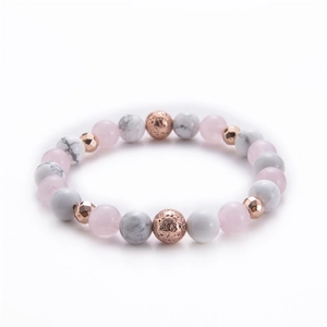 Detailed macro view of 8mm pink quartz and marble stone beads with rose gold accents
