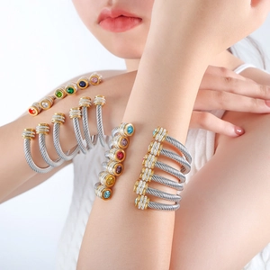 Titanium steel cable bracelet set featuring colorful cubic zirconia and gold-tone details