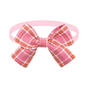 Detail view of pink plaid pet bow tie with soft texture and durable ribbed fabric loop