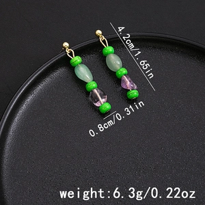 Detail showing dimensions of retro beaded tassel earrings on a black textured tray
