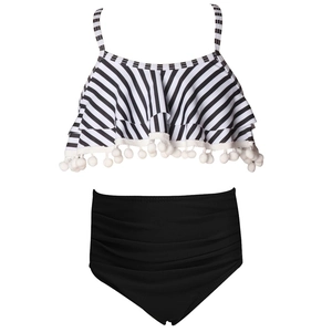 Two-piece girls' swimsuit with striped ruffle top, pom-pom trim and high-waist black bikini bottom