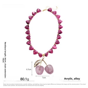 Detail of purple acrylic heart beads and large cherry pendant on 46+10cm chain
