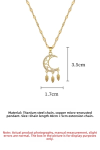 Detail of moon pendant with micro-set stones and leaf charms on titanium steel chain