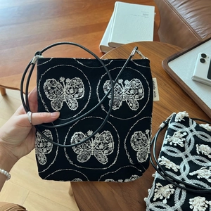 Retro canvas crossbody bag in black with exquisite white butterfly embroidery and strap