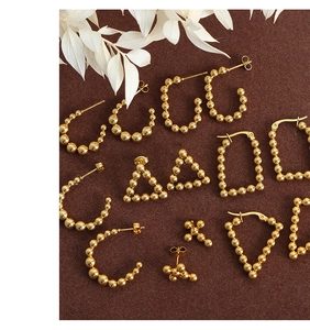 Detailed set of 18k gold-plated U-shaped beaded earrings with various geometric shapes
