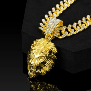 Classic golden lion head pendant necklace featuring an iced-out Miami Cuban link chain