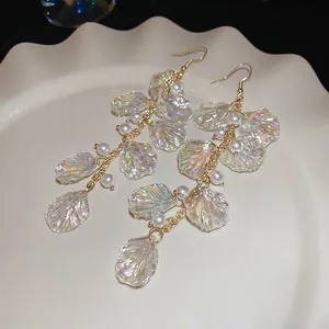 Elegant bohemian long drop earrings with iridescent shell petals and white faux pearls