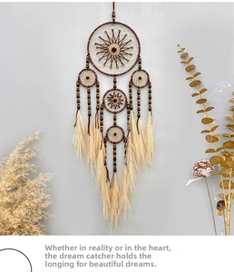 Detail of bohemian five-ring dream catcher with wooden beads and long tassels