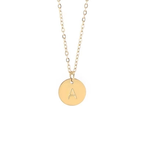 Detailed view of an 18k gold plated round pendant necklace featuring an engraved letter A