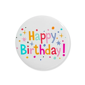 Close-up of a white Happy Birthday badge with colorful stars and festive patterns