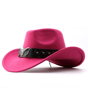 Detail of rose red felt cowboy hat featuring silver bull head metal ornament and rivets