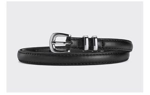Close-up of black leather belt for women featuring a shiny silver buckle and double loops