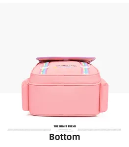 Detail view of the wide flat bottom and side pockets of this pink unicorn school bag
