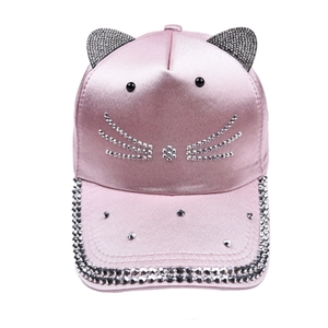 Detail of pink satin baseball cap with rhinestone cat ears and sparkling whiskers