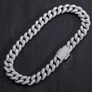 Macro shot of 18mm silver Cuban link chain with zircon pavé and iced out box clasp