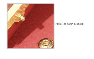 Macro detail of red lychee texture bag showing golden star engraved snap closure